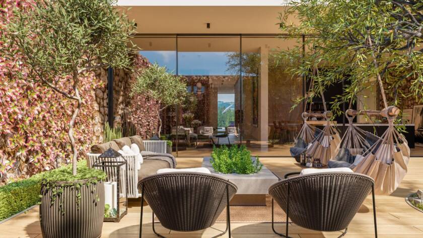Mediterranean-style outdoor living space with two hammocks and comfortable furniture arranged for relaxation.