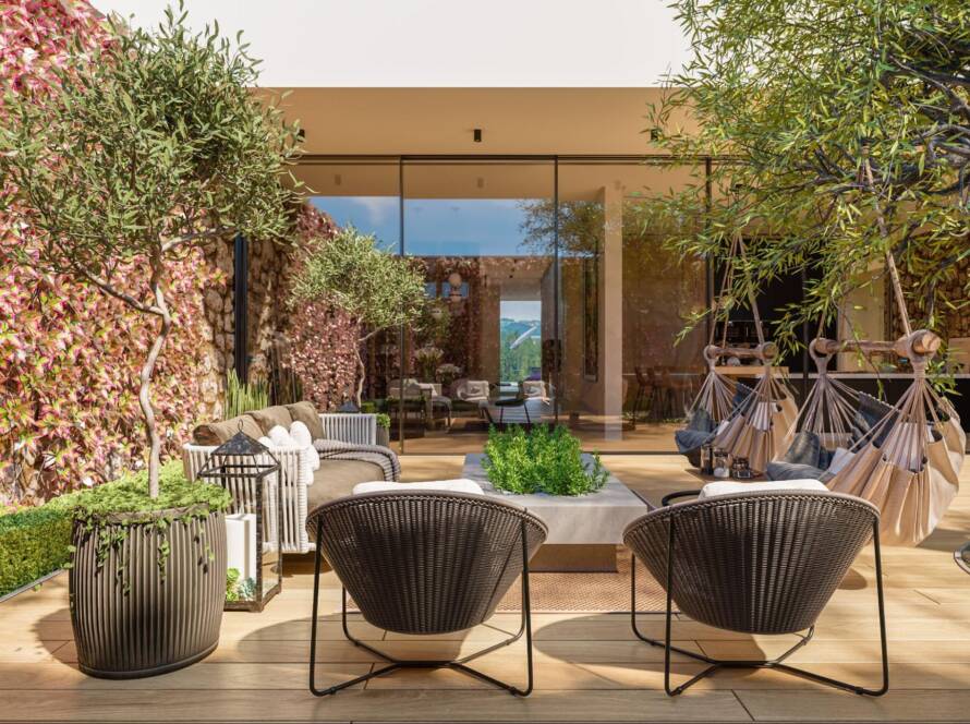 Mediterranean-style outdoor living space with two hammocks and comfortable furniture arranged for relaxation.