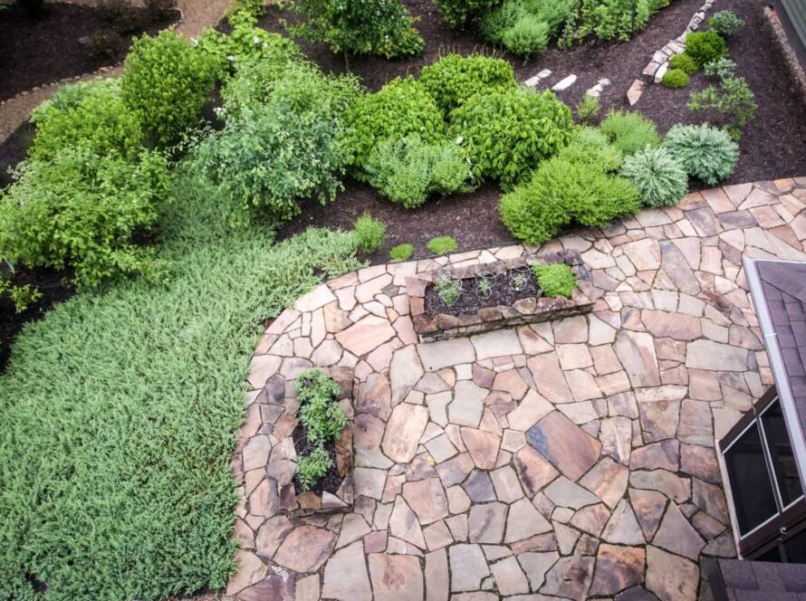 Bird’s-eye view of a garden and patio featuring Tennessee Flagstone hardscape design.