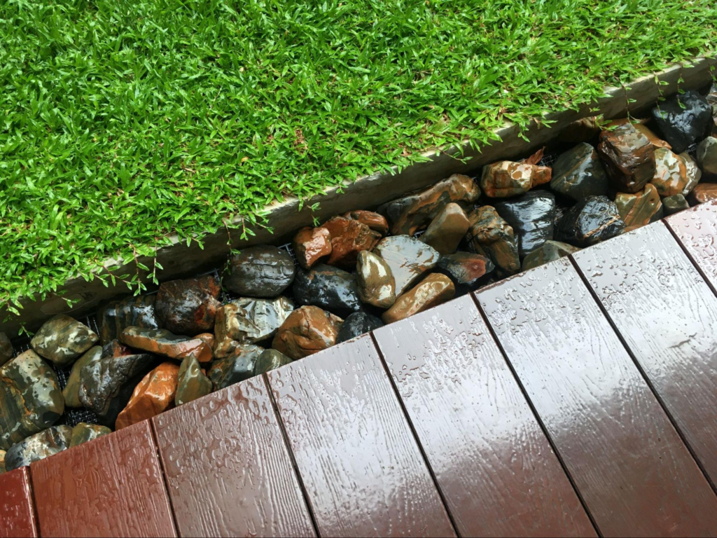 Lawn and rocks at the edge of a balcony to control erosion.